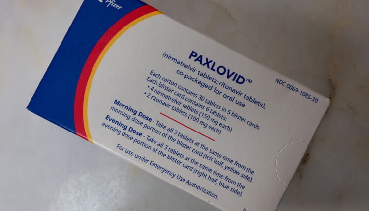 A box of Paxlovid is photographed from above.