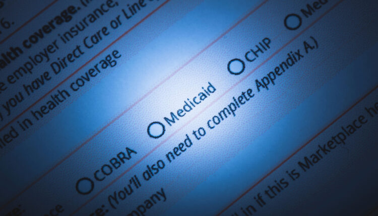 A photo of a health insurance form with a spotlight on "Medicaid."