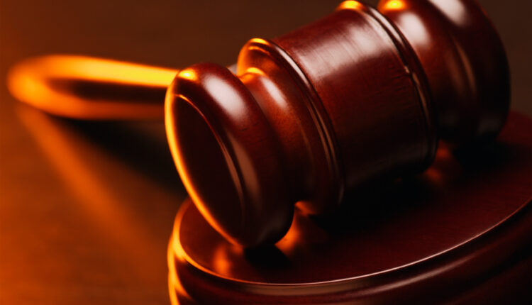 A photo of a gavel resting on its block.